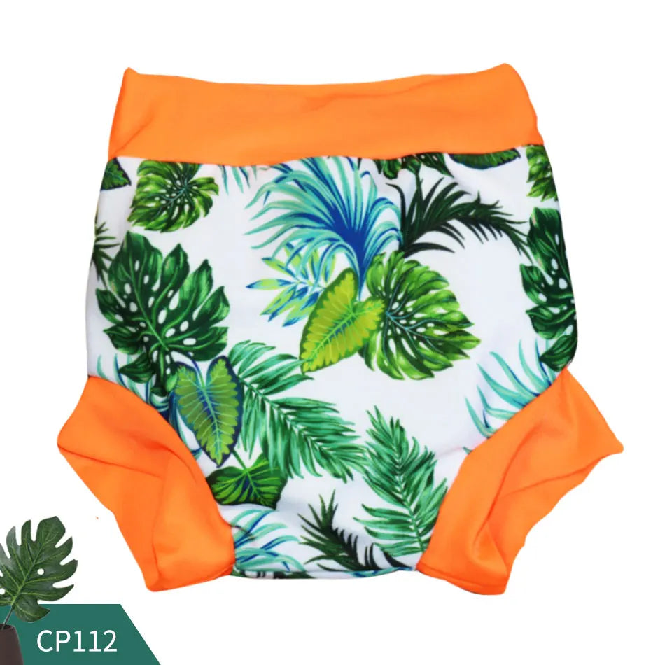 Reusable swim diaper with tropical leaf print and orange trim, style CP112, perfect for baby water play.