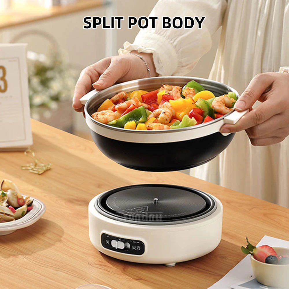 Portable electric split cooking pot with black bowl, held food, and white base with controls