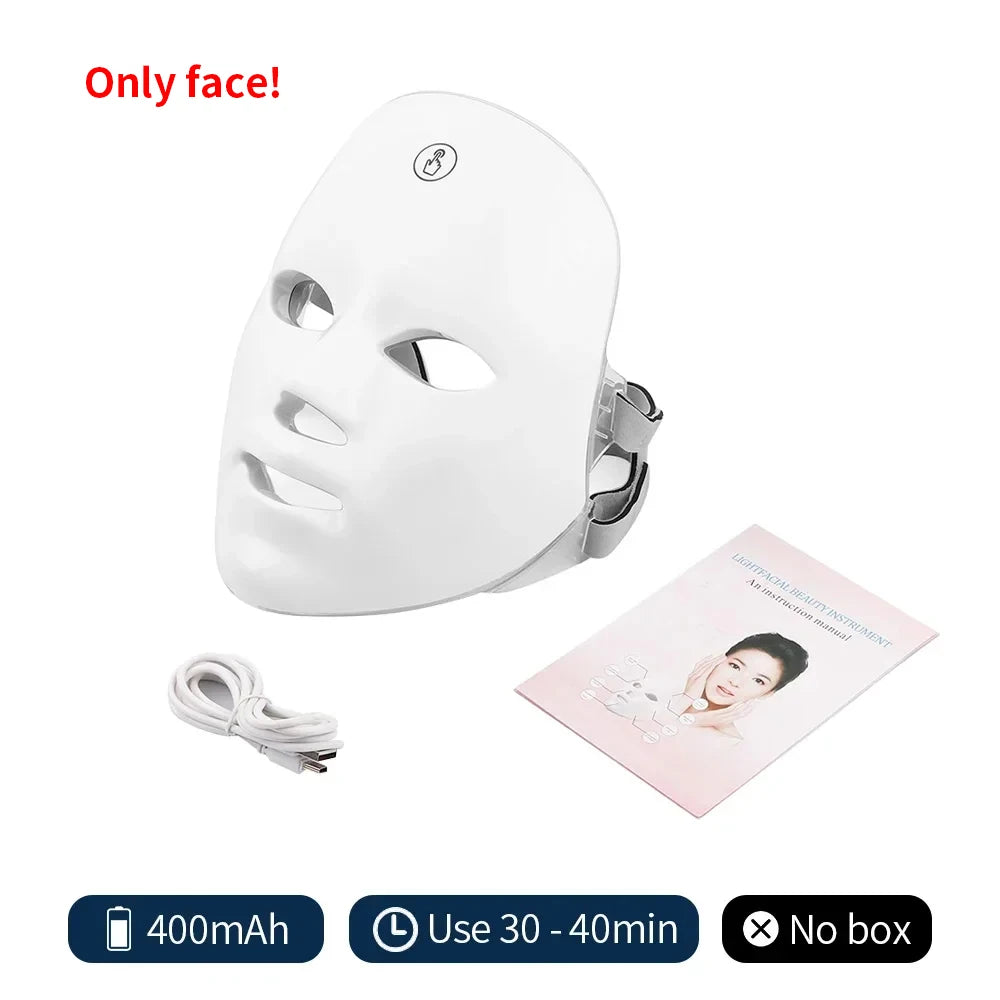 White plastic LED facial skin care mask with charging cable and instruction manual.