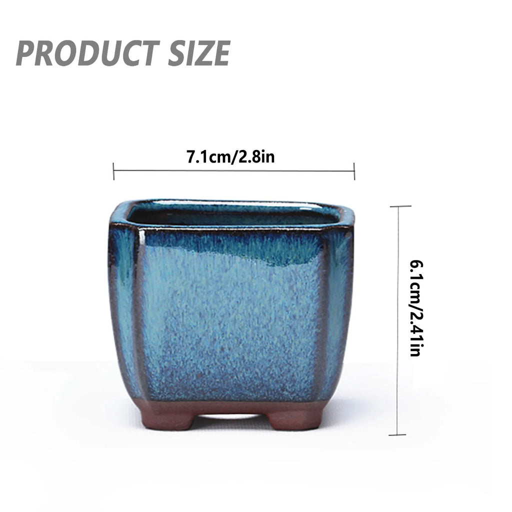 Blue ceramic square planter pot with terracotta feet and open top