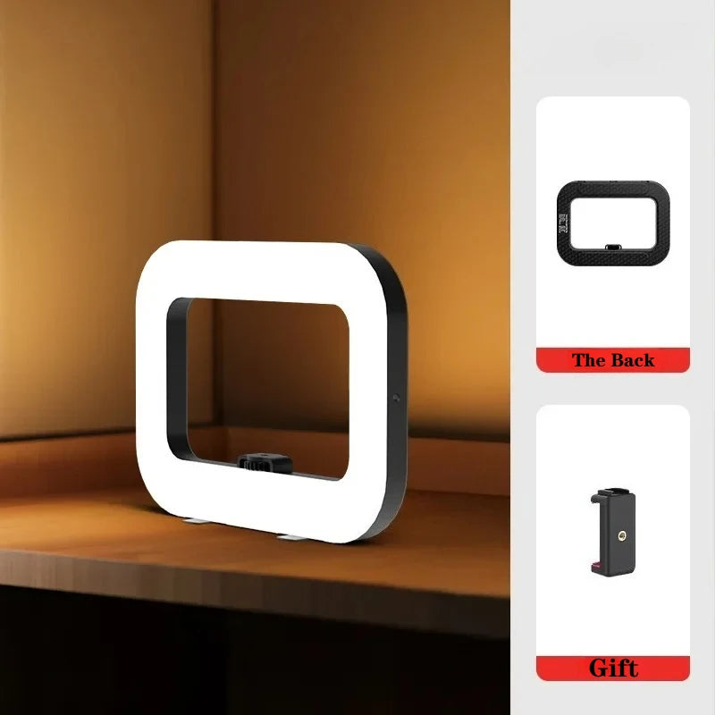 Square LED ring light with black frame, for desk use. Includes a separate phone clip attachment.