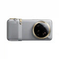 Silver Xiaomi 14 Ultra photography kit case with a textured grip, gold accents, and a large circular camera module.