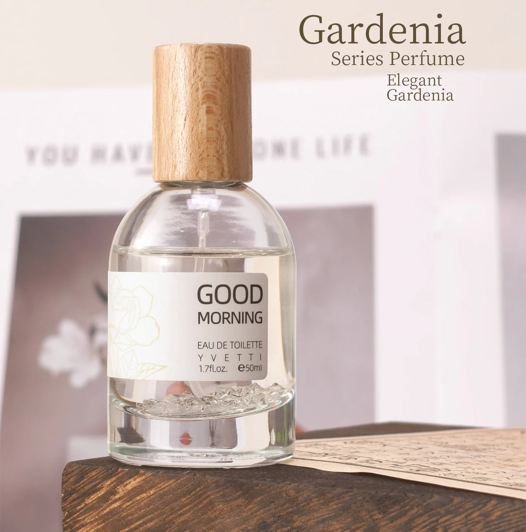 Pure Gardenia niche fresh floral perfume in a clear glass bottle with a minimalist wooden cap and crystal base.