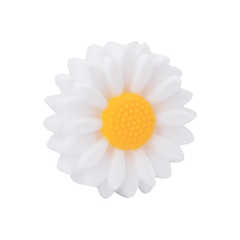 White and yellow daisy silicone baby teething toy for soothing sore gums.
