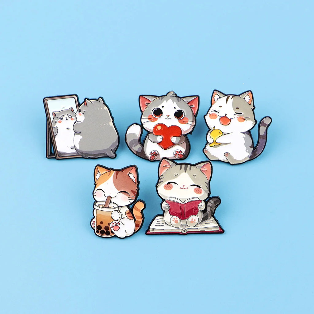 Set of 5 cute cat enamel pins for backpacks or jackets. Colorful kawaii kitten brooches, perfect gift for cat lovers.