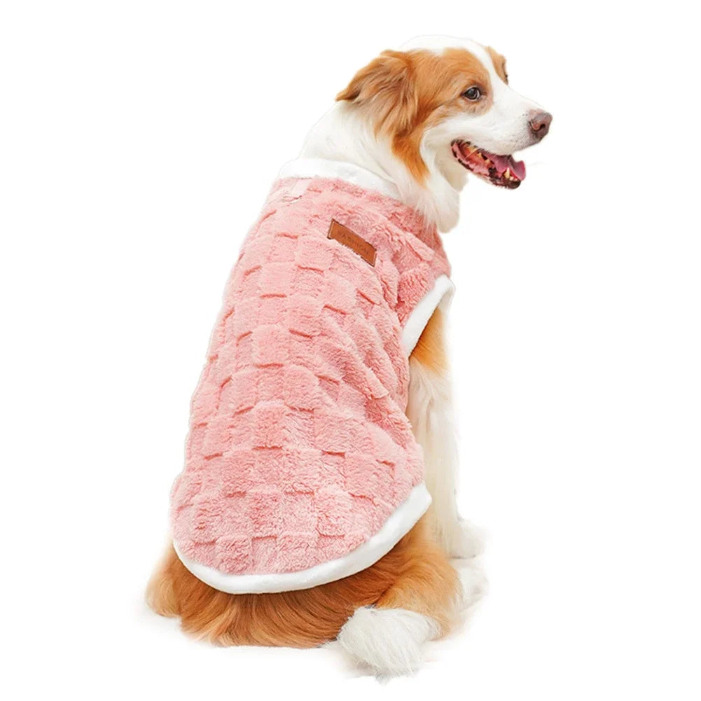 Dog wearing a cozy, pink checkered plush winter sweater vest for warmth and stylish pet comfort.