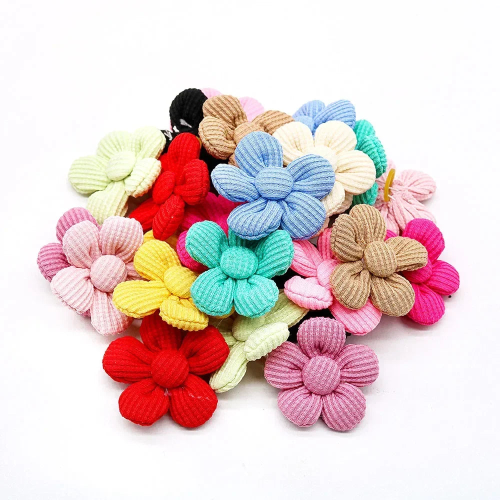 Colorful flower hair bows for small dogs and cats. Durable rubber band grooming accessories for cute pet styling.