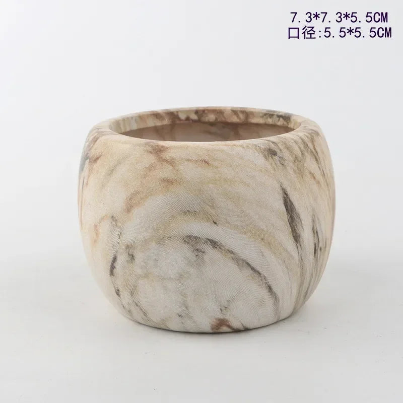 Ceramic succulent pot with marble-look finish in off-white and dark gray swirls