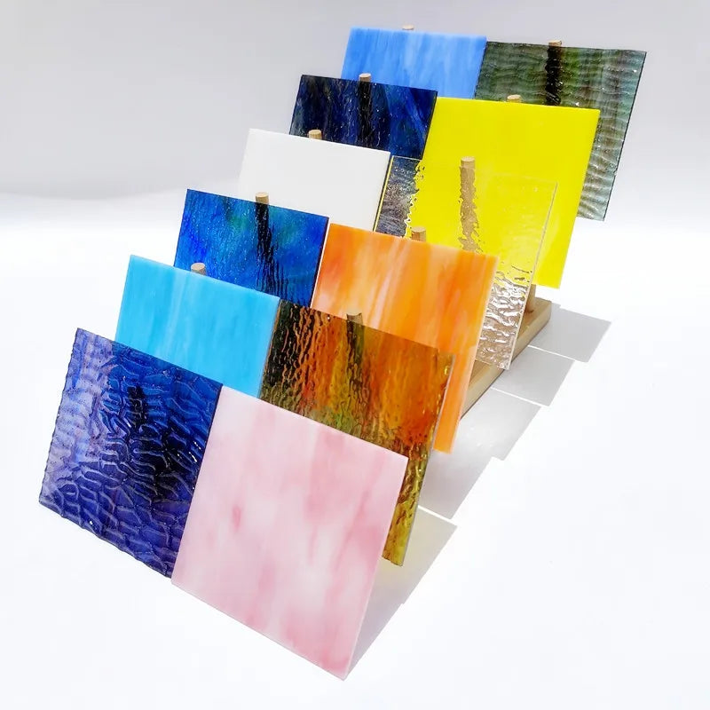 Assorted textured translucent stained glass square tiles, blue, yellow, orange, pink, dark blue