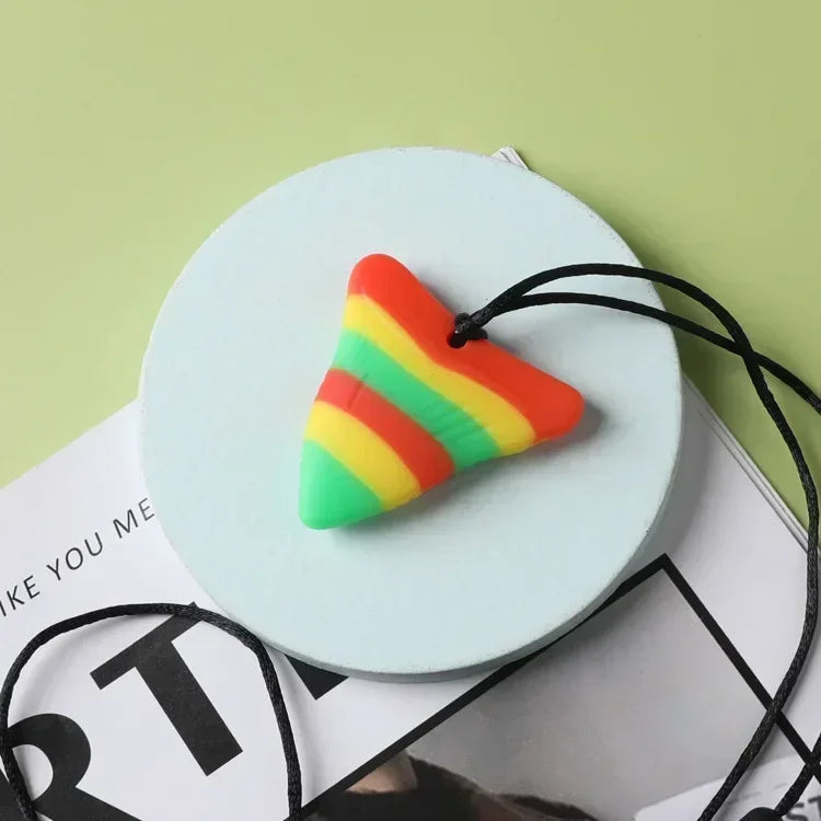 Colorful silicone triangle baby teething toy for relief.