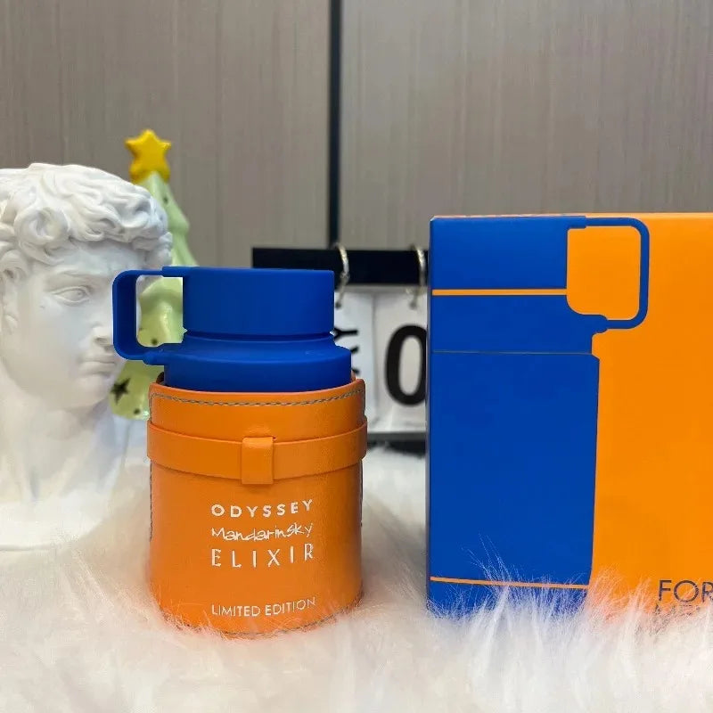 Armaf Odyssey Mandarin Sky Elixir: Unisex woody EDP in a unique orange leather-wrapped cylindrical bottle with box.