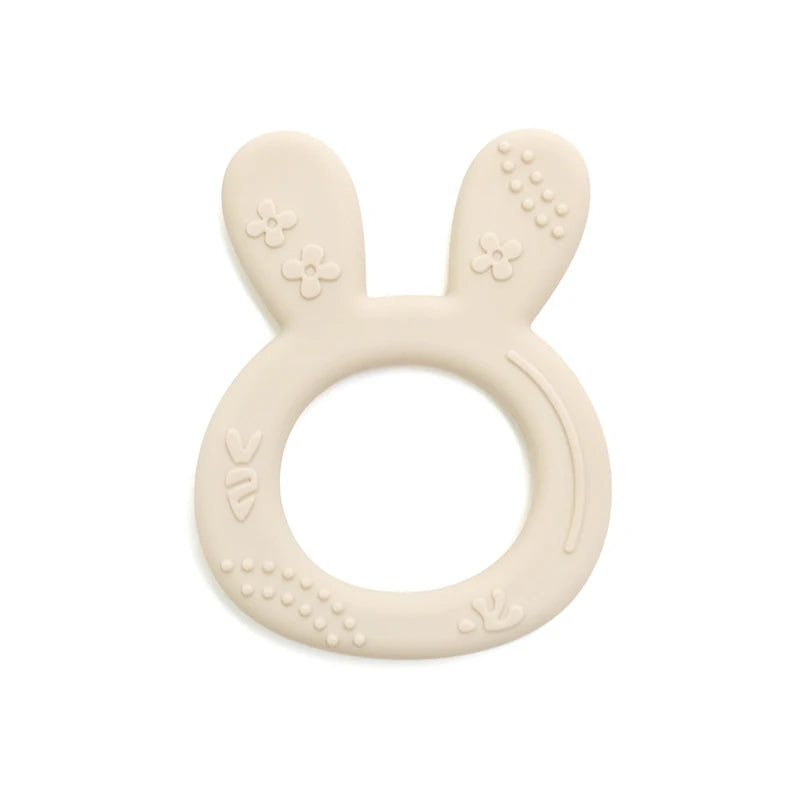 Beige silicone baby teething ring with bunny design for infant teething relief.