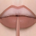 Long-lasting matte nude lip liner pencil applying a smooth, waterproof velvet finish to lips for defined makeup.
