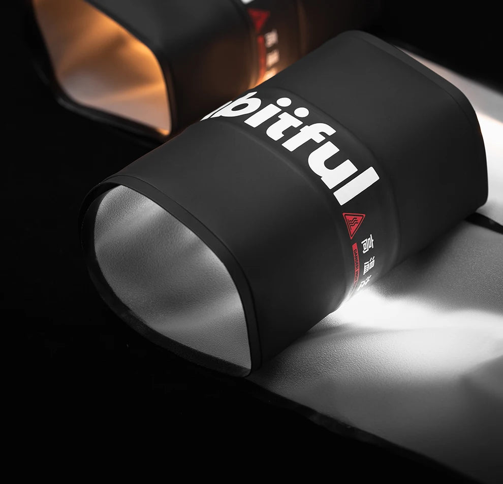 Matte black silicone heat-resistant wrap for hot hair styling tools, featuring white text and a hazard warning label.