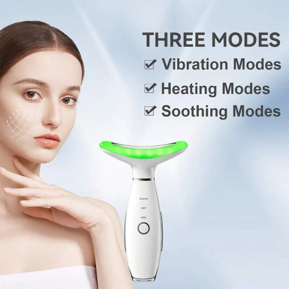 White, T-shaped handheld facial massager with a green glowing head, featuring vibration, heat, and soothing modes.