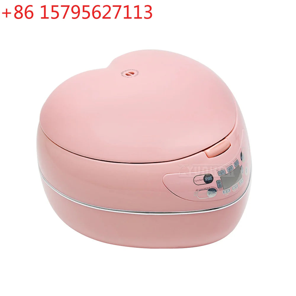 Pink heart-shaped mini rice cooker with closed lid and front control panel