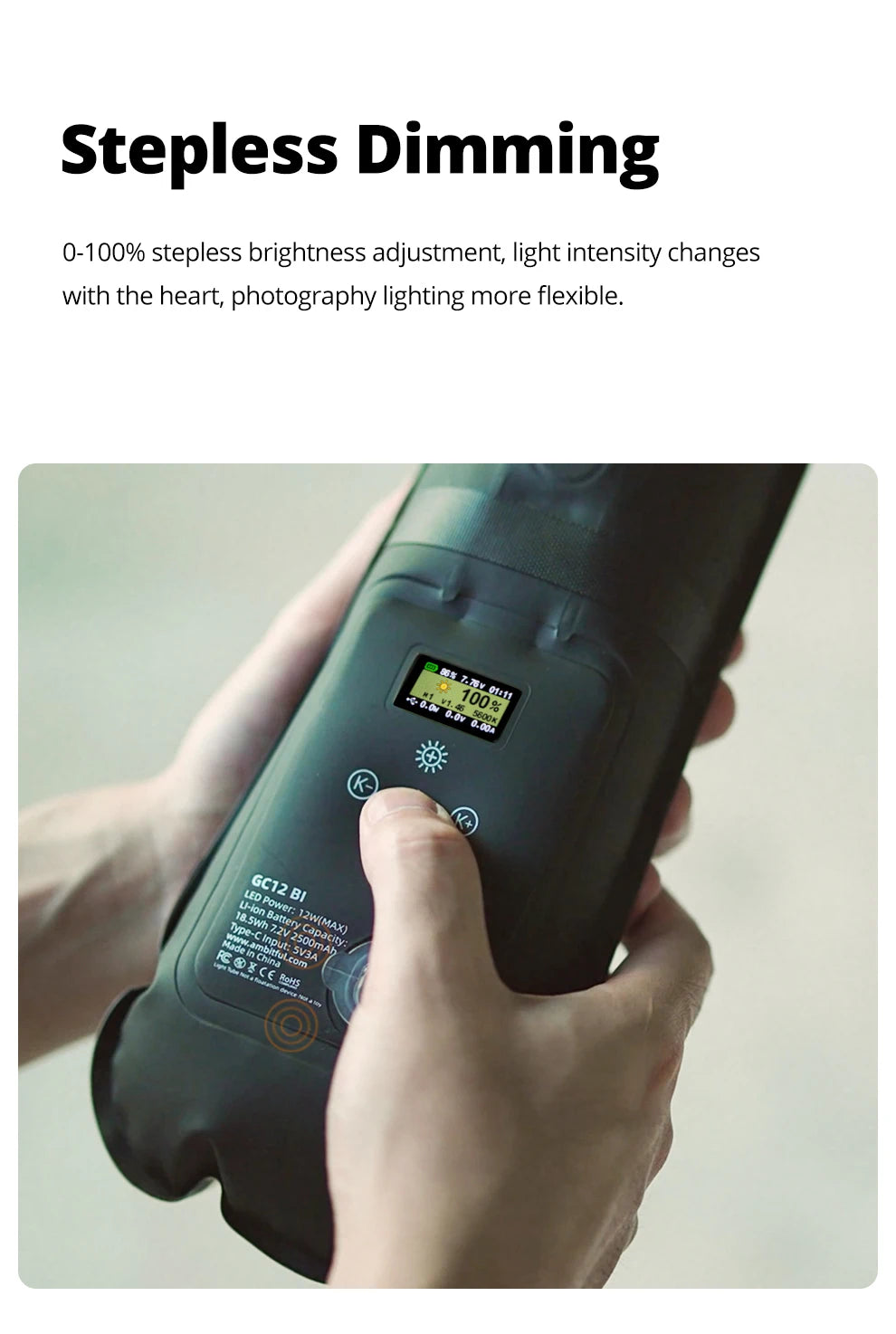 Handheld black LED light tube with a small digital screen, control buttons, and charging port for photography.