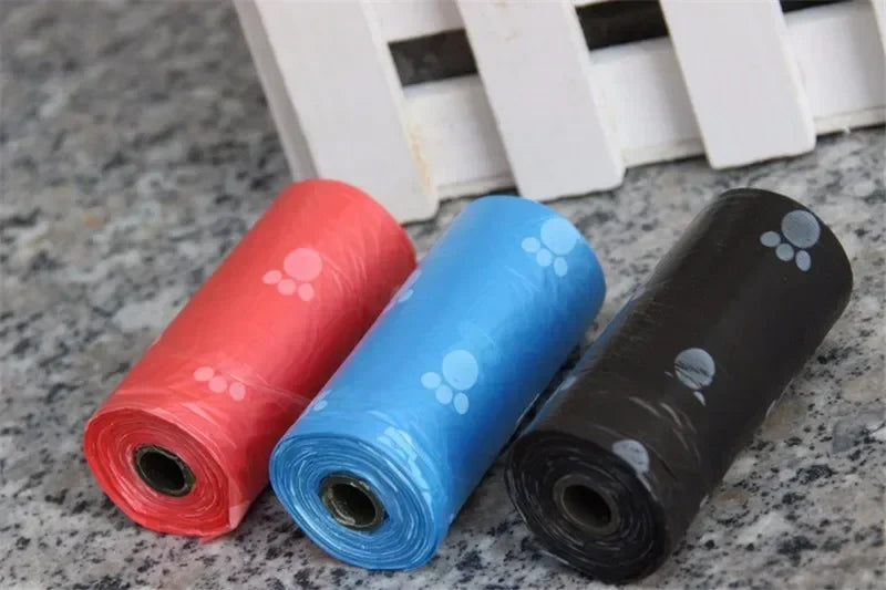 Leak-proof dog poop bags with cute paw print design in assorted colors for easy and clean pet waste disposal.