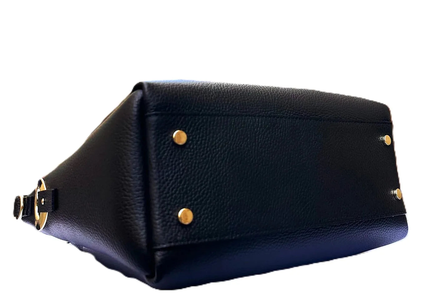 Royaa black genuine leather tote bag featuring a textured pebble finish, gold metal feet, and side hardware detail.