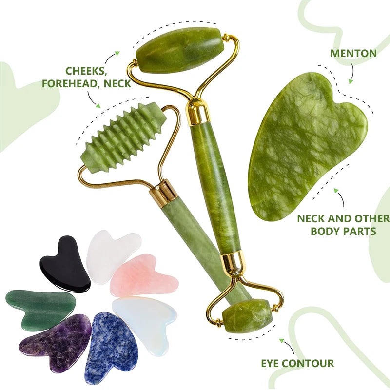 Green jade facial rollers and multiple heart-shaped guasha stones in various colors like pink, black, and purple.