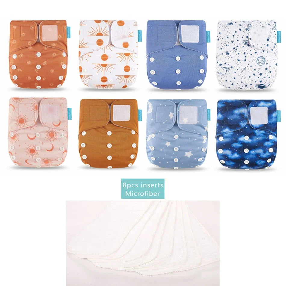 Set of 8 reusable cloth diapers with celestial patterns and 8 microfiber inserts for baby care.