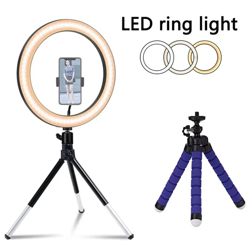 LED ring light with smartphone holder on a metal tripod, plus an extra flexible foam-covered blue tripod.