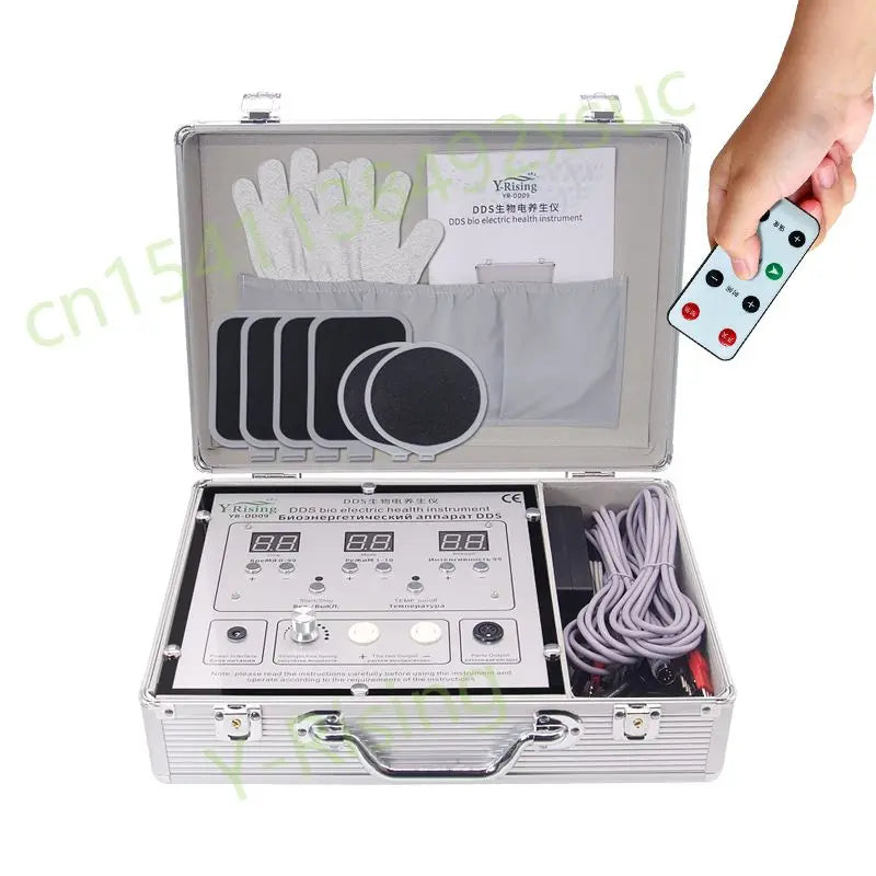 DDS bioelectrical body therapy massager in silver case with digital display, remote control, and conductive electrodes.