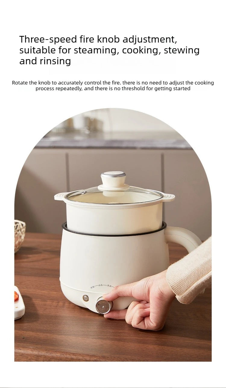 White electric multi cooker hot pot with lid and front speed knob, ready to steam