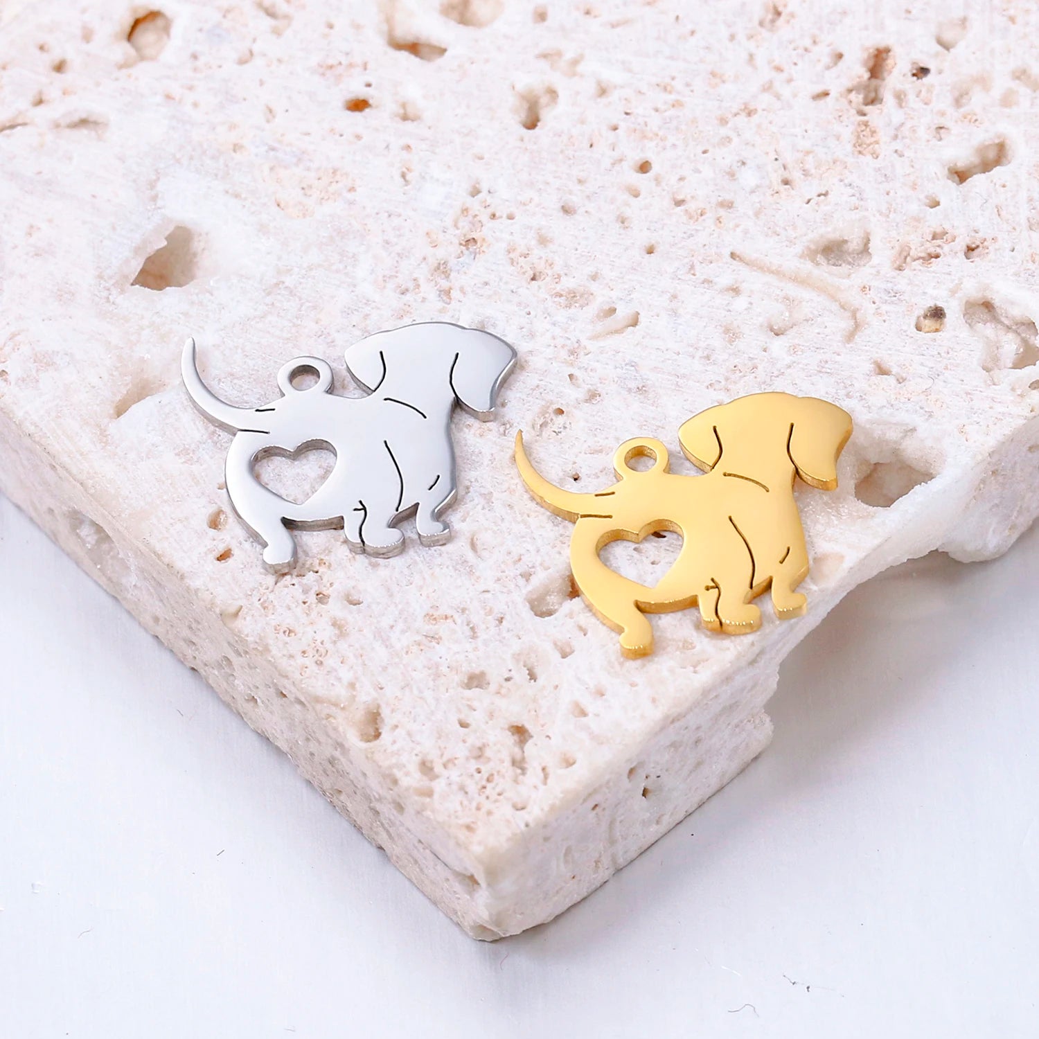 Gold and silver stainless steel dog heart pendants for DIY pet-themed jewelry making and necklace charms.
