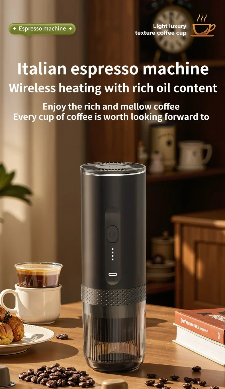 Portable black cylindrical Italian espresso machine with wireless heating and clear lower chamber on a wooden table.