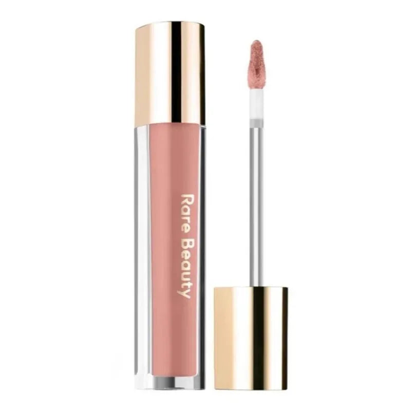 Rare Beauty Soft Pinch Tinted Lip Oil in a neutral mauve shade with a glossy doe-foot applicator and gold cap.