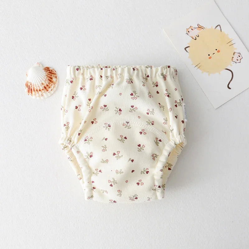 Floral print baby training diaper with soft elastic waistband for comfortable baby care.