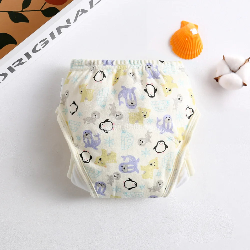 Baby training diaper with cute penguin, seal, and polar bear print. Absorbent cotton baby care underwear.