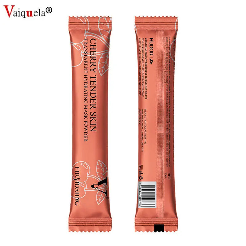 Two sides of a thin, metallic coral-pink sachet of Cherry Tender Skin hydrating face mask powder.