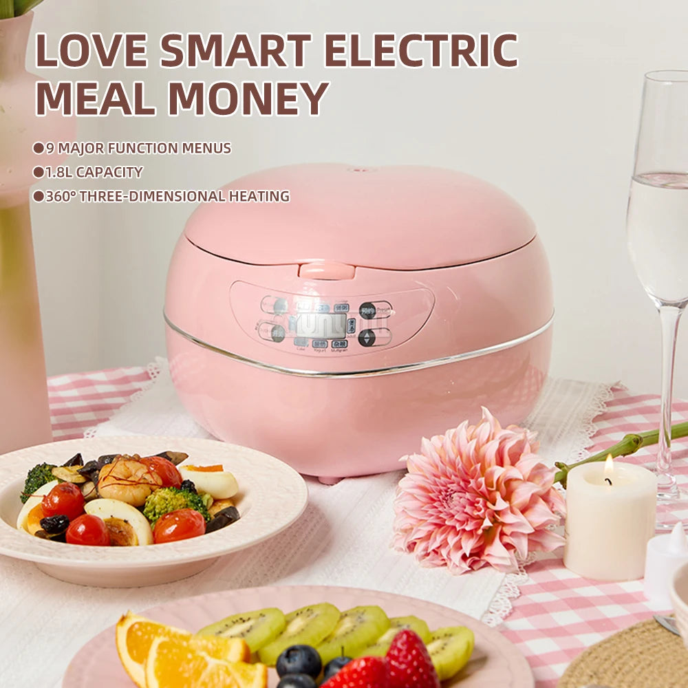Pink heart-shaped electric rice cooker on table with indicator panel visible