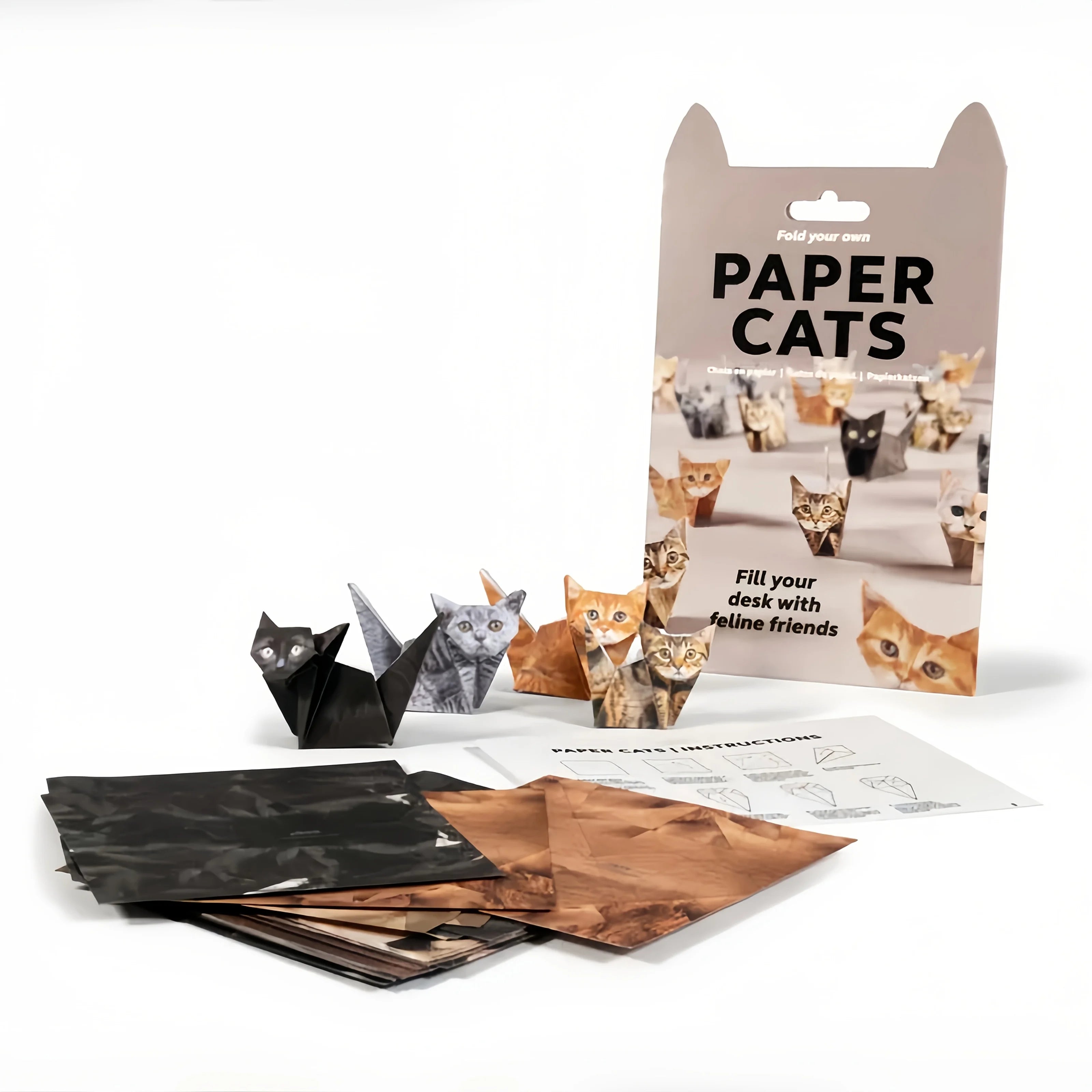 Paper Cats origami kit with folded paper cat figures, craft sheets, and instructions. Perfect gift for cat lovers.