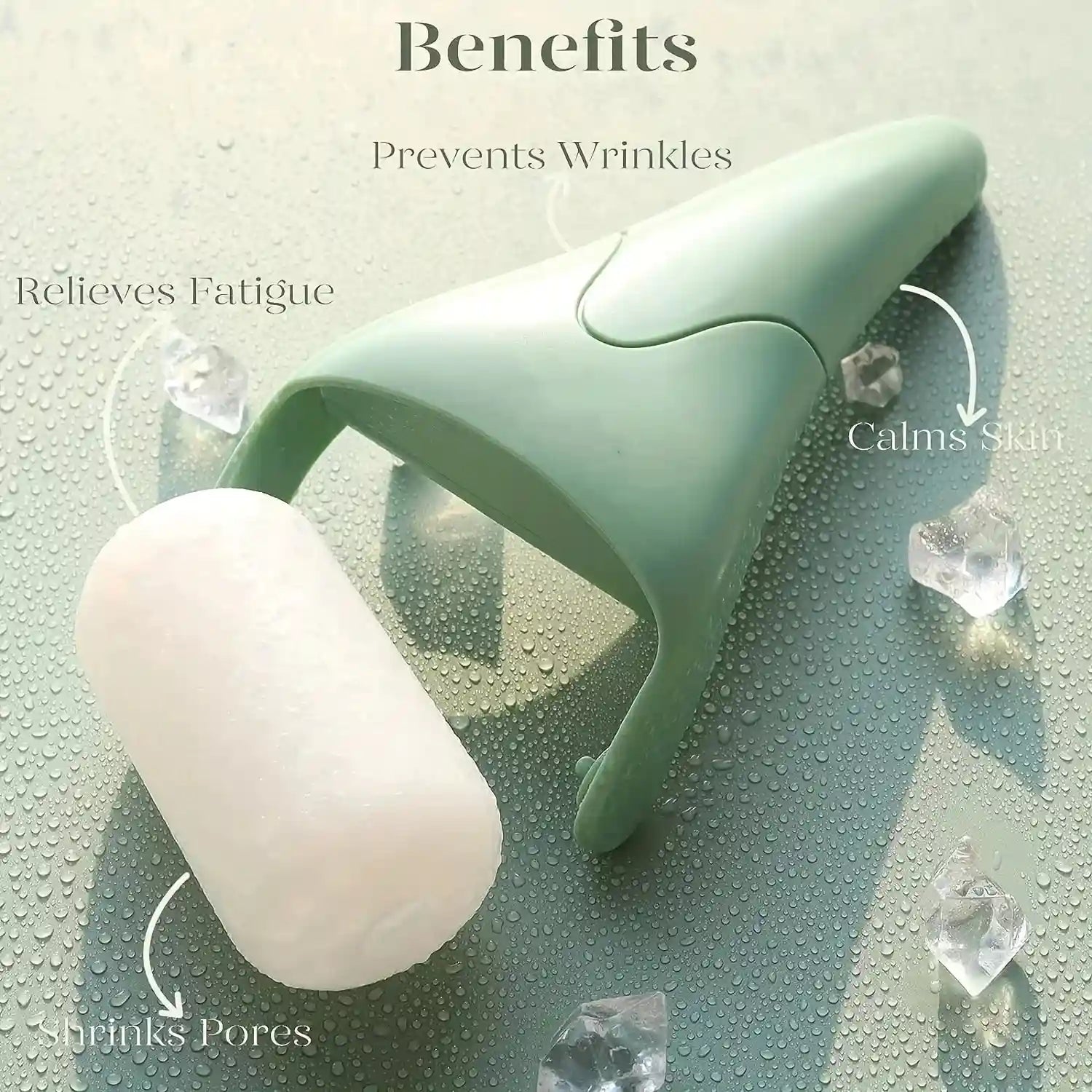 A sage green handheld facial ice roller with a white cylindrical roller head resting on a wet, water-dropped surface.