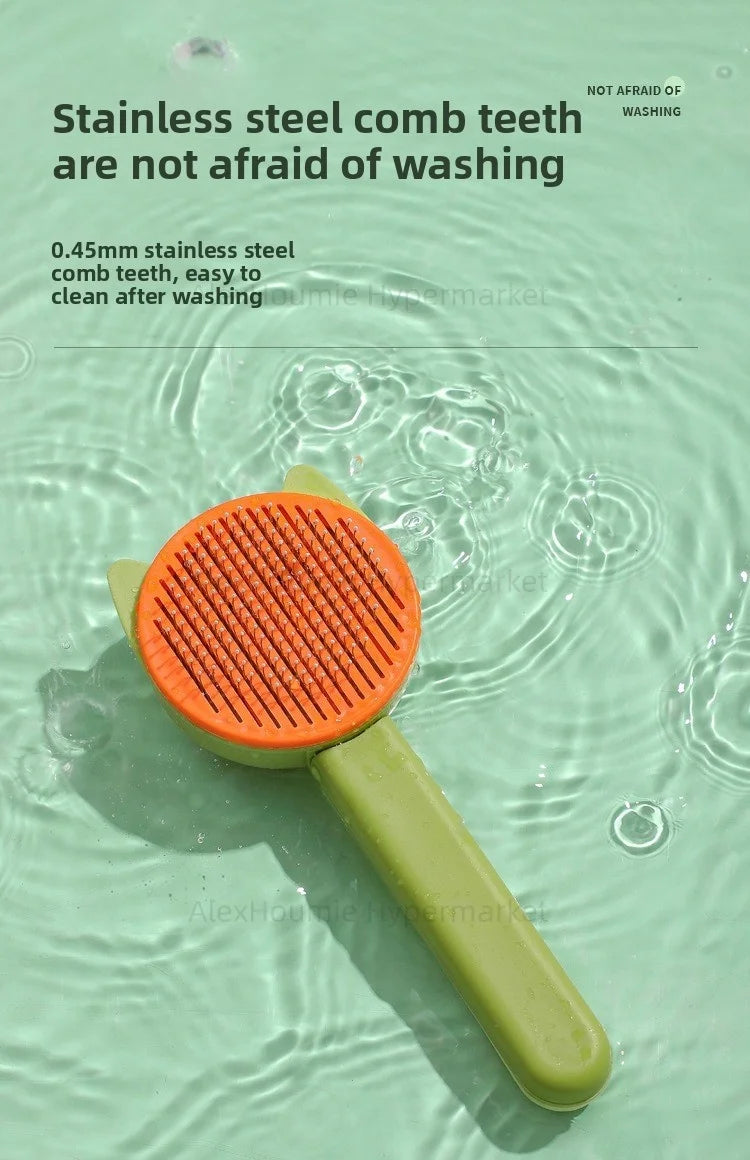 Green and orange cat grooming brush with stainless steel teeth for easy hair removal and washing.