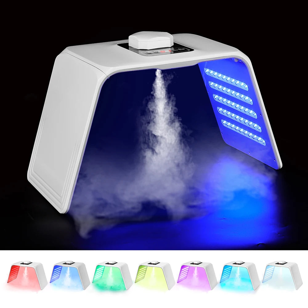White arch-shaped facial LED light therapy machine emitting mist and various colored lights for skin rejuvenation.