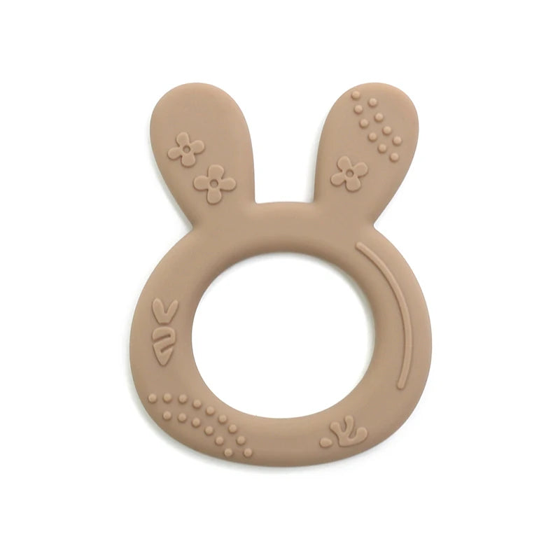 Beige silicone bunny teething ring for baby teething relief.