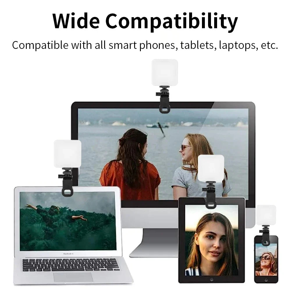 Small square LED video light with a black clip, mounted on various laptops, tablets, and smartphones for lighting.