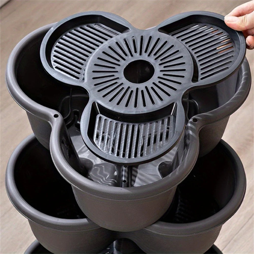 Black modular vertical garden planter base with drainage insert and center outlet