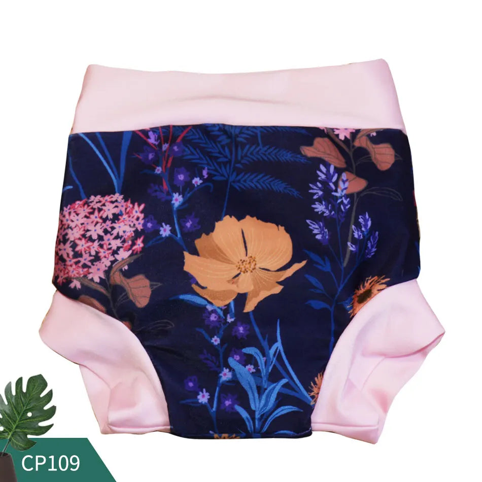 Reusable cloth swim diaper, floral botanical print on navy with pink trim, CP109 baby care style.