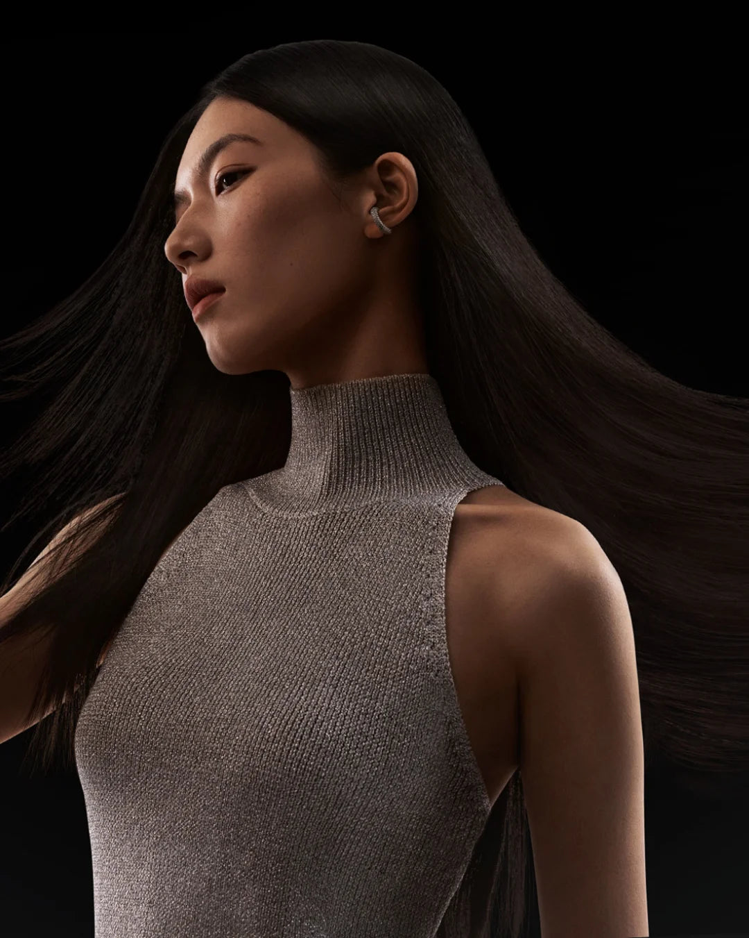 Model with sleek, healthy hair blown by MIJIA High-Speed Hair Dryer Pro for shiny, professional styling results.
