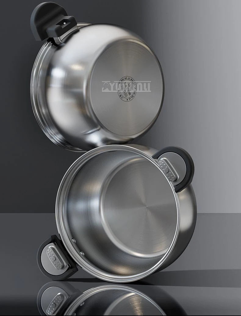 Stainless steel pressure cooker with lid open and pot interior visible
