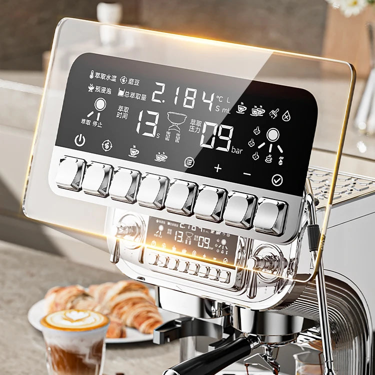Modern stainless steel espresso machine with digital touch display and glass shield on a kitchen counter.