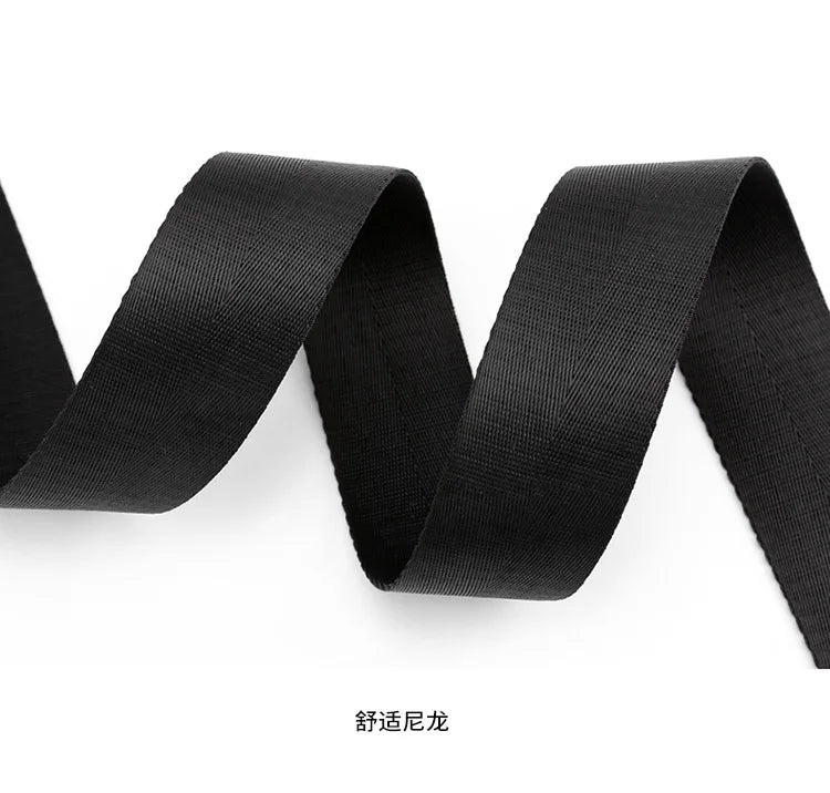 Durable black nylon webbing strap for minimalist women’s designer handbags, featuring a textured, woven finish.