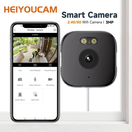 Window smart security camera with black housing and lens view, paired with phone app screen.