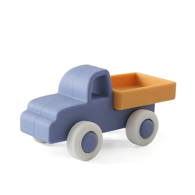 Blue and orange silicone truck baby teething toy for soothing sore gums.