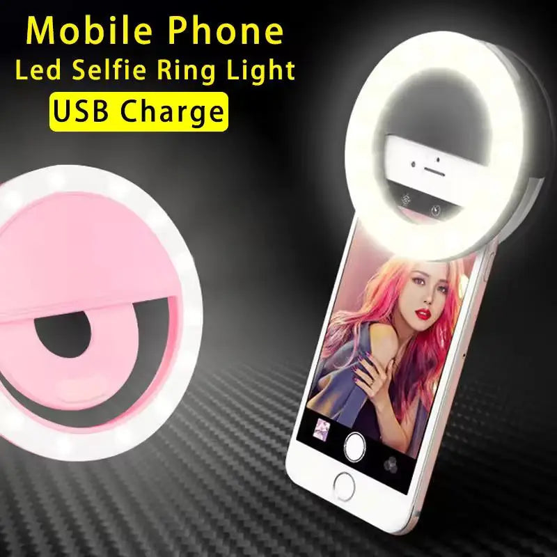 Round, pink LED ring light that clips onto a smartphone to provide illumination for selfies and videos. USB